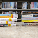 A picture of two stacks of books; these books are featured in the full blogpost