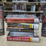 a stack of true crime titles including Agent Sonya, The Ghosts of Eden Park, Furious Hours, Burned, If You Tell, The Kidnap Years, and American Predator